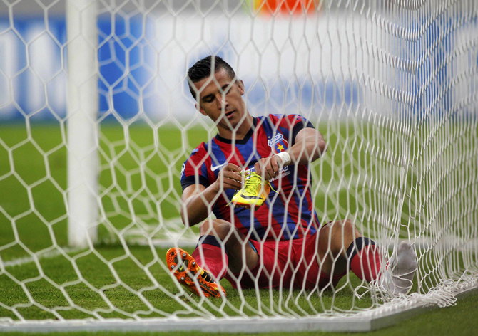 Steaua Bucharest's Georgievski reacts after scoring an own goal during their Champions League soccer match against Chelsea at the National Arena in Bucharest