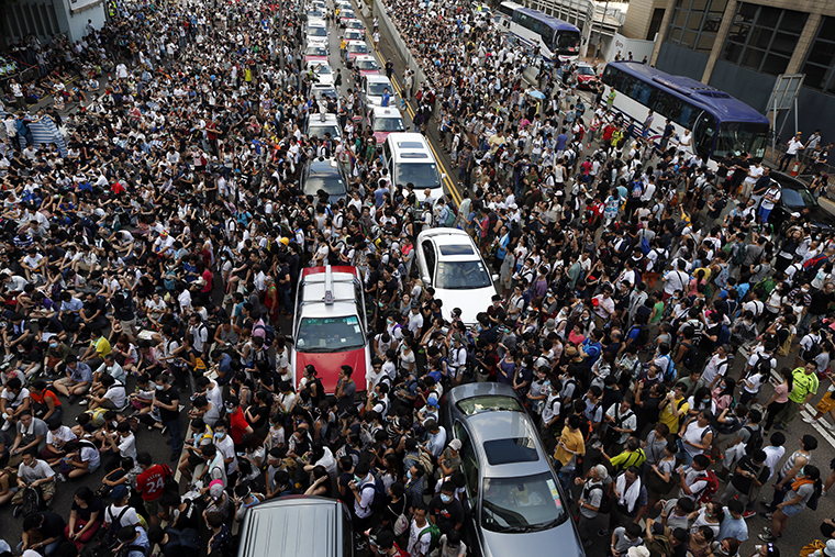 Traffic stands still as tens of thousands of protesters jam the main street leading to the financial Central district outside the government headquarters in Hong Kong