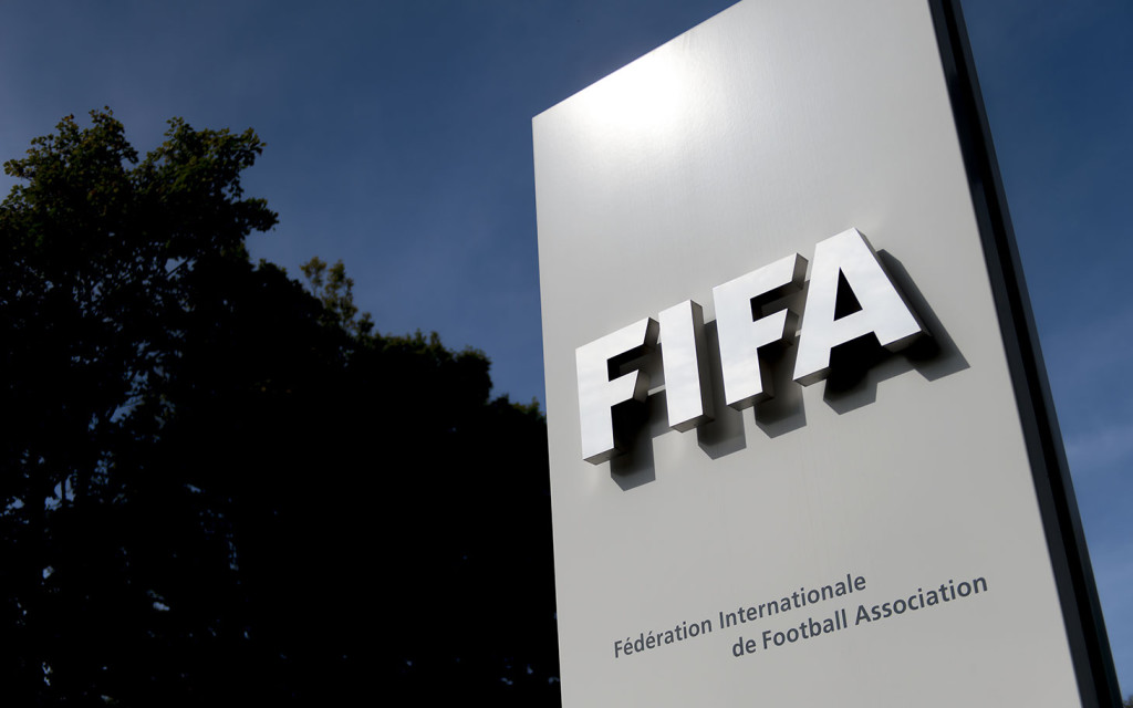 The logo of the global football's governing body FIFA is seen on October 3, 2013 at its headquarters in Zurich. FIFA kicked off a crunch meeting behind closed doors, amid claims of rights abuses by 2022 World Cup Qatar and wrangling over plans to hold the tournament in the winter.  AFP PHOTO / FABRICE COFFRINI        (Photo credit should read FABRICE COFFRINI/AFP/Getty Images)